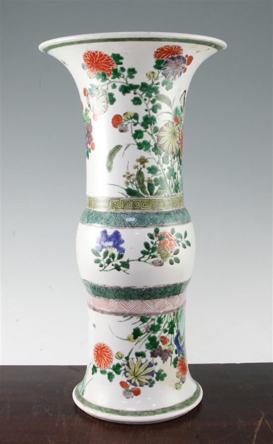 A large Chinese famille verte beaker vase, Gu, Kangxi period, 44.5cm, 11 x 3.5cm section of rim lacking